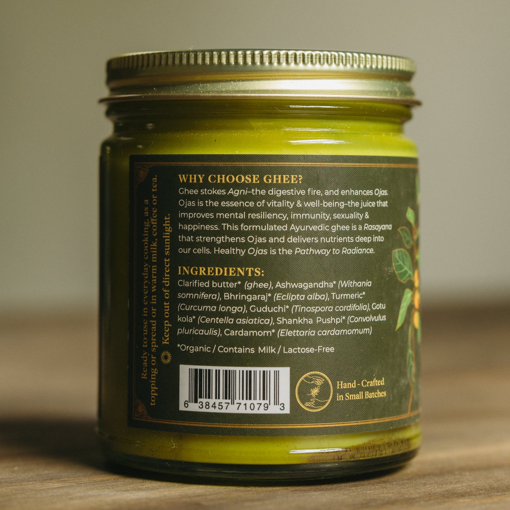 Herbal Ghee Jar with a label on a wooden surface


